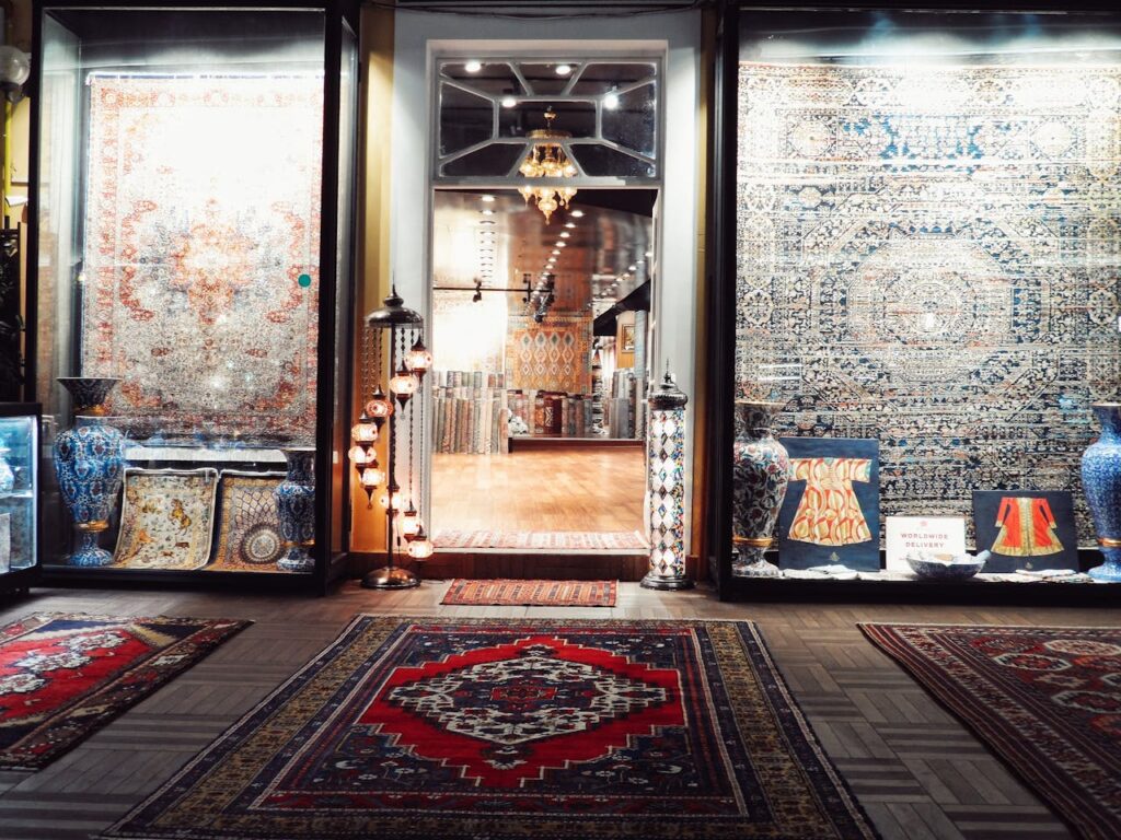 Showcasing intricate Persian rugs and decorative vases at an upscale boutique.